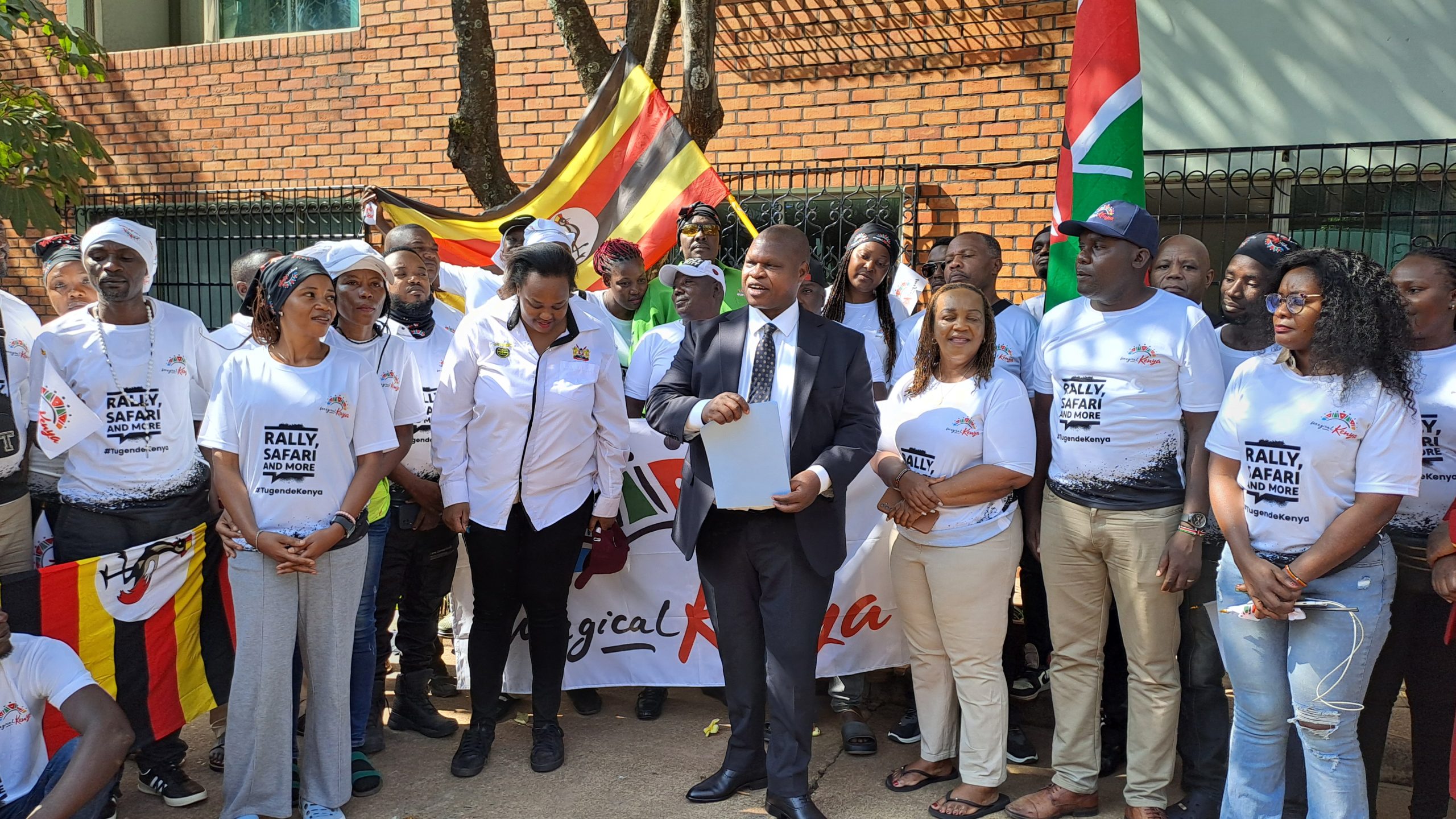 Kenya high commission to Uganda Joash Maangi flagging off the team of Ugandan sports fraternity heading to Kenya for the WRC Rally championships.